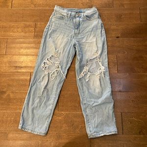 Baggy, ripped blue jeans. Size 26.